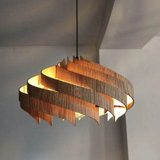 Decorative wood wave pendant light close-up, elegant ceiling hanging lamp