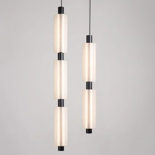 White cylindrical glass pendant light close-up, contemporary hanging ceiling lamp
