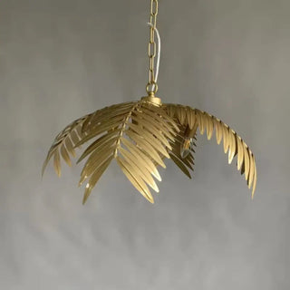 Designer gold pendant light with tropical leaf motifs, luxury hanging ceiling lamp