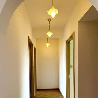 Glass star pendant ceiling light in modern home, elegant decorative hanging lamp