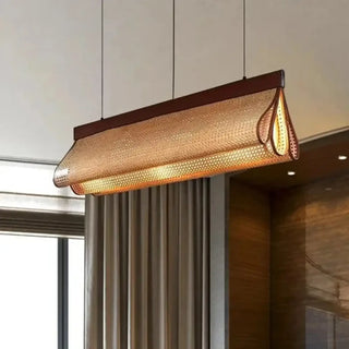 Linear rattan pendant close-up — natural fiber ceiling light fixture