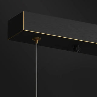 Modern linear pendant lamp close-up, clear glass minimalist hanging ceiling light