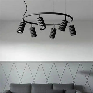 Round wooden pendant lamp hanging over kitchen island — Scandinavian design