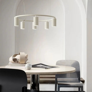 Wood ring pendant light illuminated — warm Nordic kitchen fixture