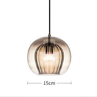 Modern glass pendant ceiling fixture detail, gold accent elegant hanging lamp