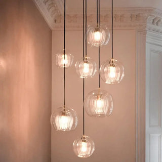 Elegant glass pendant light with gold detail, modern living room ceiling fixture