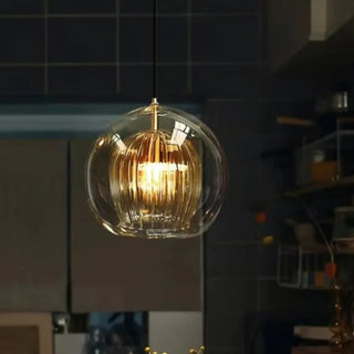 Modern glass pendant light with gold detail, elegant living room ceiling fixture