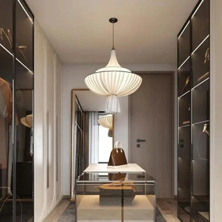Ornate pleated pendant lamp in warm setting, decorative lantern-style ceiling fixture