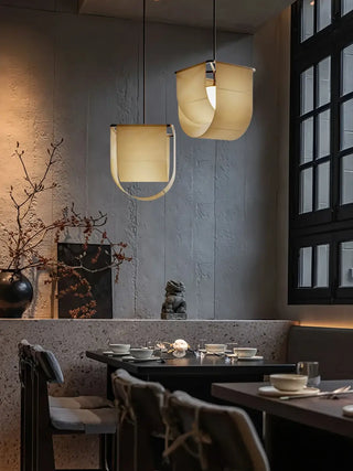 Zen fabric pendant light illuminated — warm beige Asian-inspired lamp