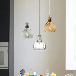 Modern colored glass ceiling lamp close-up, designer pendant light with soft glow
