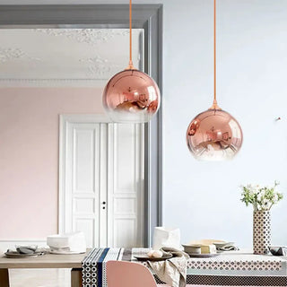 Modern round glass pendant light with gold tint, designer hanging ceiling lamp