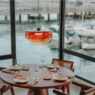Colored glass pendant lamp in interior — warm ambient ceiling light
