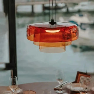 Tinted glass pendant light close-up — designer hanging lamp for living room