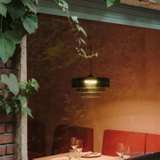 Amber tinted glass pendant illuminated — warm cozy ceiling fixture