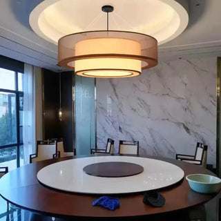 Dimmable circular pendant light in living room — elegant ceiling fixture