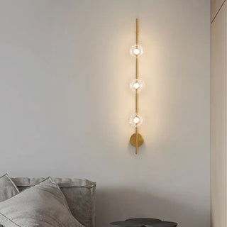 LOMBROU wall sconce close-up transparent glass panel detail
