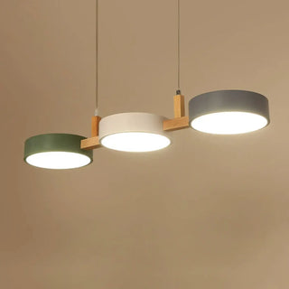 Nordic triple round wood pendant light with colored accents, modern soft ambient lighting