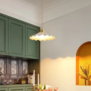 Brass wavy shade pendant light close-up, retro chic hanging ceiling lamp