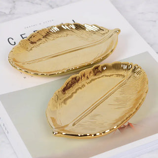 gold leaf ceramic tray earthworks elegant jewelry organizer dish enamel coating close-up