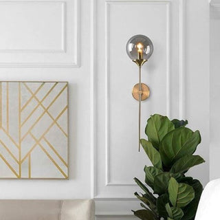 Close-up of amber glass wall sconce — Scandinavian designer wall lamp