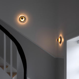 Bedside glass wall lamp in bedroom — warm LED sconce