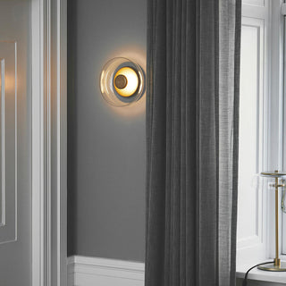 Glass bedside wall lamp close-up — warm ambient LED